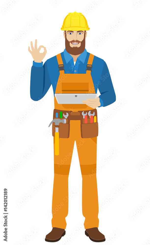 Worker holding digital tablet PC and showing a okay hand sign Worker holding digital tablet PC and showing a okay hand sign