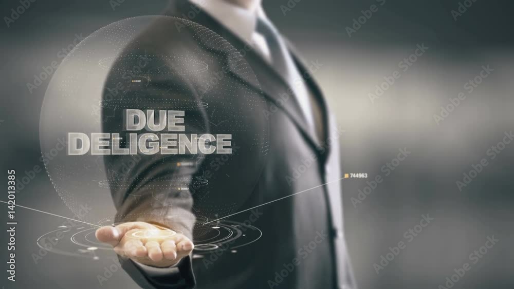 Due Deligence with hologram businessman concept Due Deligence with hologram businessman concept