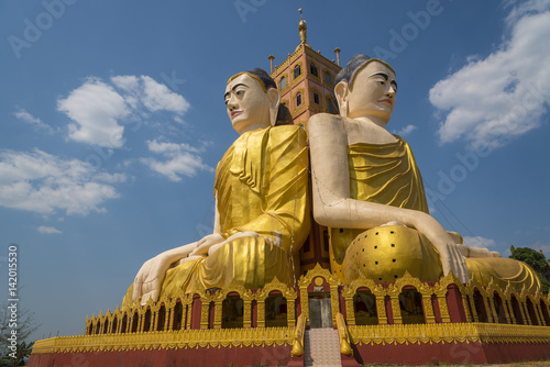 Big golden Buddha against b...