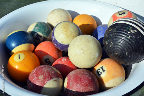 Billiard and Croquet Balls in a Bowl