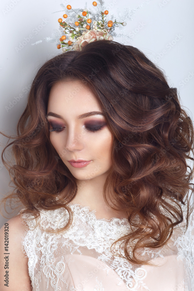 Fototapeta premium Beautiful bride posing in peach wedding dress and Flower crown in a white photo Studio.Close up portrait
