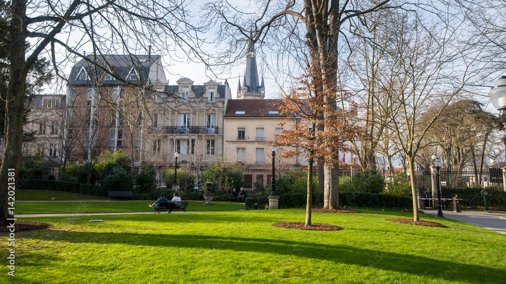 Sunny walk in Epernay town hall garden, France