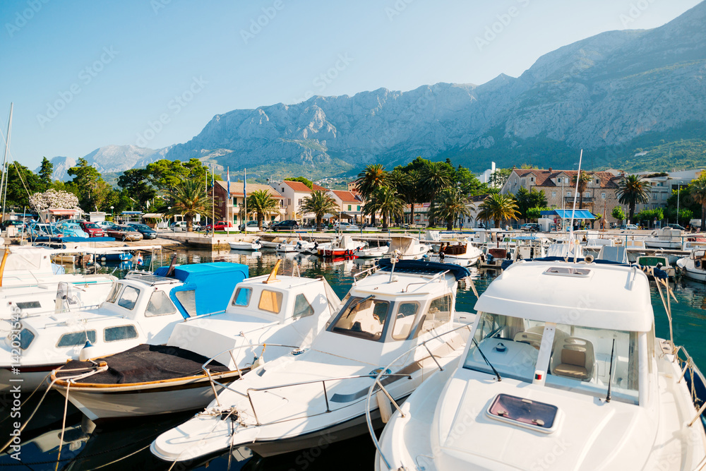 Wooden boats and fishing boats in Makarska, Croatia.