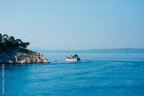 Ship with tourists, the city of Makarska, Croatia © Nadtochiy