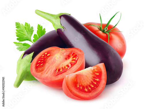 Isolated vegetables. Fresh eggplants and cut tomatoes isolated on white background with clipping path