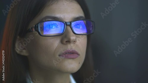 The businesswoman in the glasses work with a presentation photo