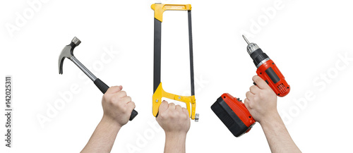 Hands Holding Hammer, Hacksaw, and Electric Screwdriver with Clipping Path