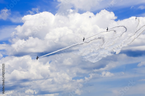 Several planes performing in an air show at Jones Beach