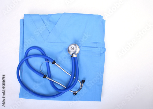 Medical stethoscope, Gloves, RX prescription on blue doctor uniform closeup. Medical tools and instruments shop, blood pressure measurement concept. you can place your text.