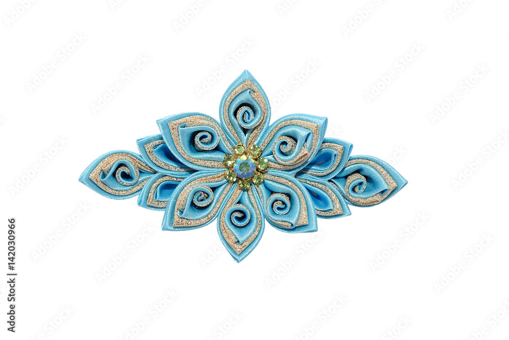 Obraz premium Kanzashi. Blue artificial flower isolated on white background