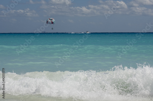 Couple flys on a parachute