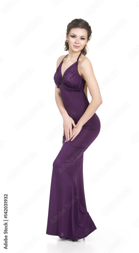 A young,smiling girl in dress posing on a white background. Studio shot, isolated image. A young,smiling girl in dress posing on a white background. Studio shot, isolated image.