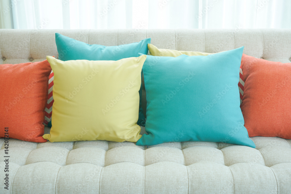Closeup colorful pillows on sofa in living room Closeup colorful pillows on sofa in living room