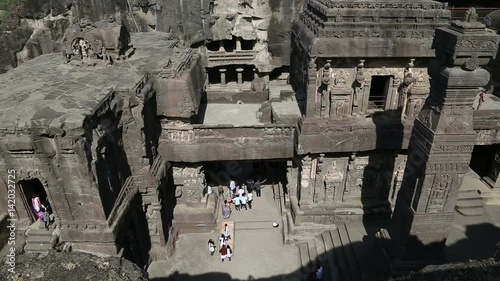 Aerial view on tourists walking through Aurangabad caves. photo