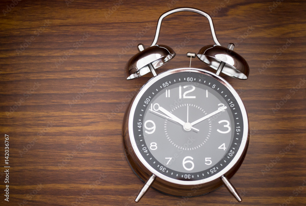 Alarm Clock On Wooden Background Alarm Clock On Wooden Background