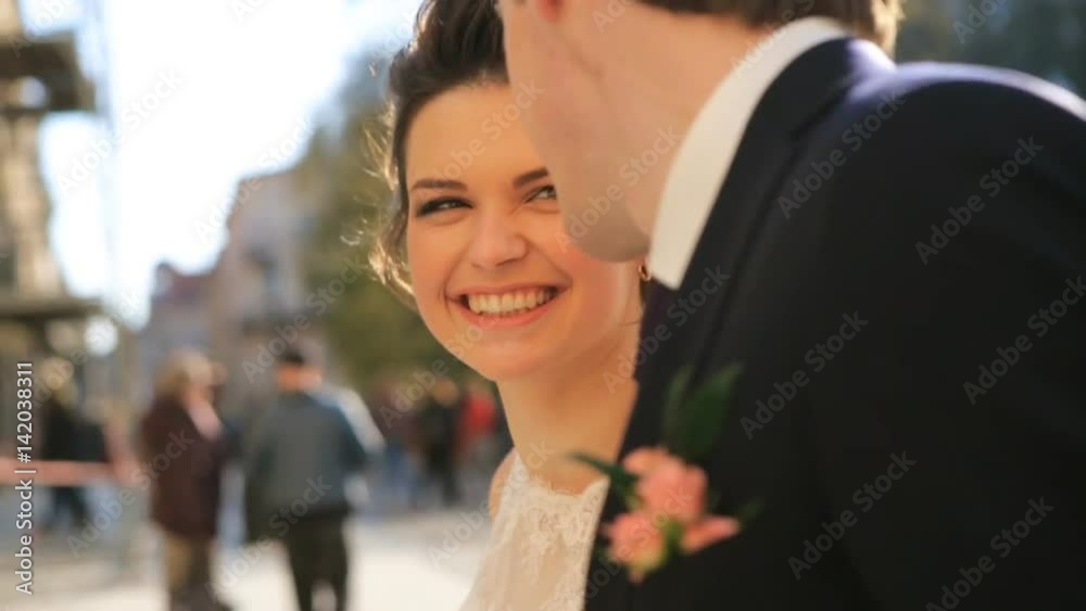 the bride and groom beautiful young couple holding hands walking shot in slow motion close up the bride and groom beautiful young couple holding hands walking shot in slow motion close up