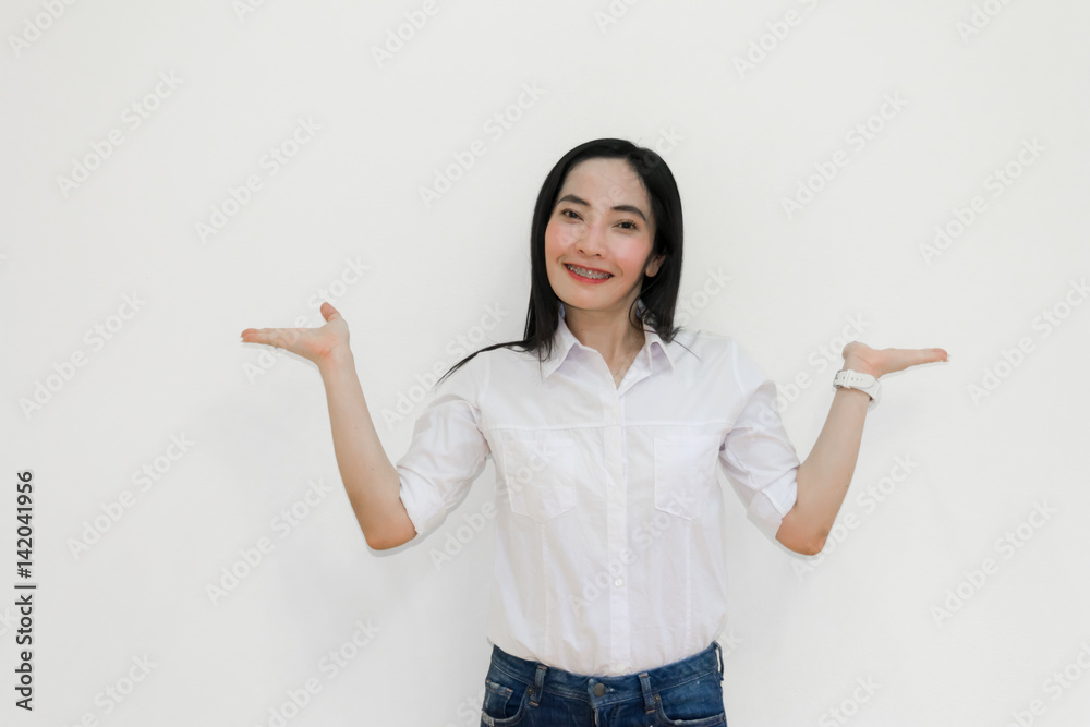 Asian young woman thinking beautiful smile put a white shirt stand of on white background.
Asian young woman thinking beautiful smile put a white shirt stand of on white background.