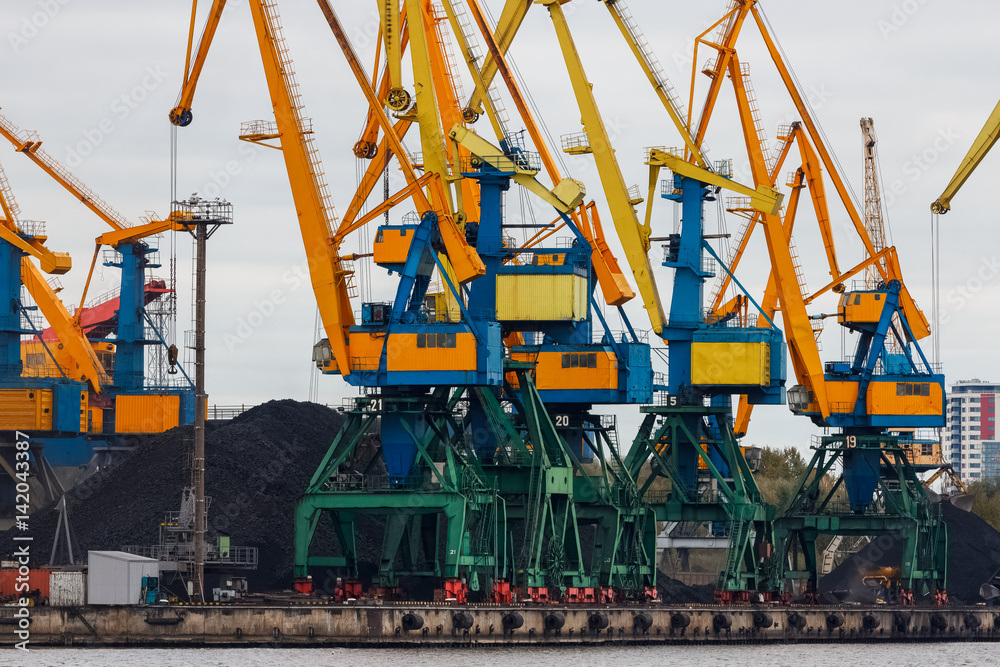 Yellow cargo cranes in the port of Riga, Europe