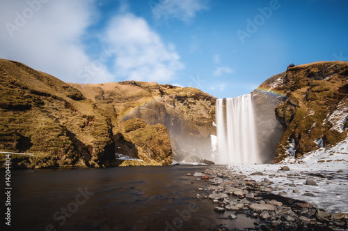 Landscaped, Skogafoss waterfall with rainbow in beautiful day at Iceland