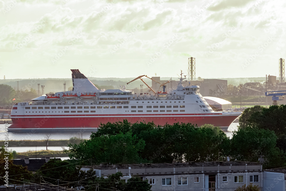 Red cruise ship. Passenger ferry sailing around the Riga city