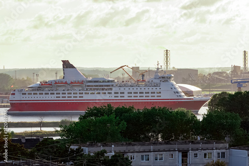 Red cruise ship. Passenger ferry sailing around the Riga city