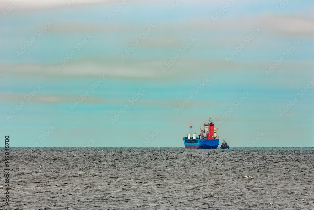 Blue cargo ship entering the Baltic sea. Riga, Europe Blue cargo ship entering the Baltic sea. Riga, Europe