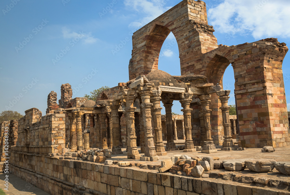 Medieval historic ruins at the Qutb Minar site in Delhi, India. Qutb Minar, along with the ancient and medieval monuments surrounding it, form the Qutb complex, which is a UNESCO World Heritage Site.
