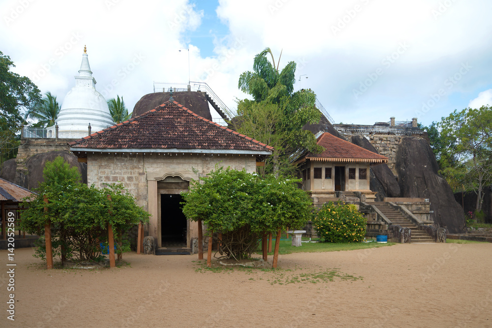 The ancient temple complex of Isurumuniya Vihara is a cloudy day. Anuradhapura, Sri Lanka