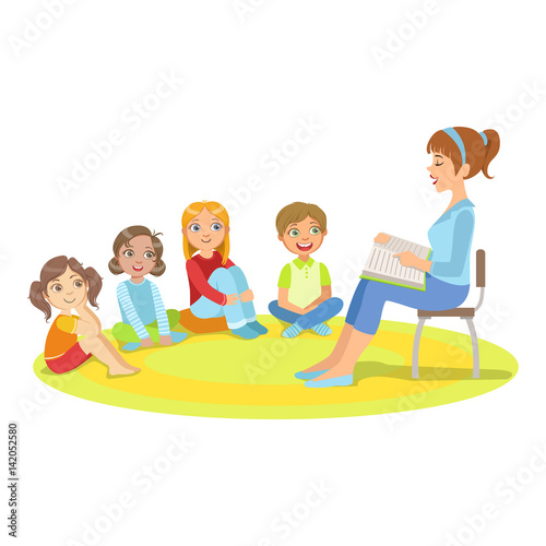 Group Of Small Kids Sitting Around The Teacher Reading A Story