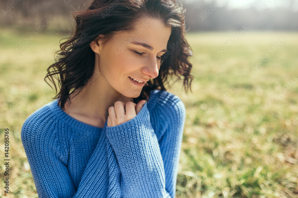 Happy smile dreamy female with closed eyes with hands on neck. Portrait of attractive brunette caucasian young woman smile with windy hair outside on spring, summer in park. Lifestyle cover concept. Happy smile dreamy female with closed eyes with hands on neck. Portrait of attractive brunette caucasian young woman smile with windy hair outside on spring, summer in park. Lifestyle cover concept.