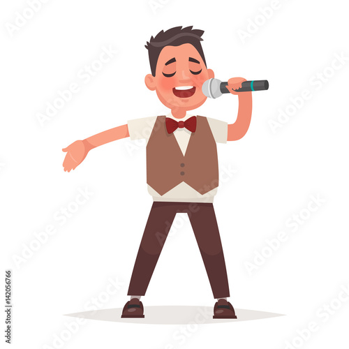 Boy sings a song in a microphone on a white background. Children's musical performance