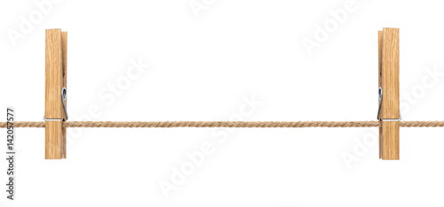 Isolated clothespins. Wooden clothespins on rope isolated on white background with clipping path photo