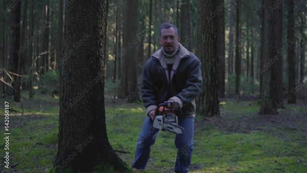 insane forest maniac with chainsaw insane forest maniac with chainsaw