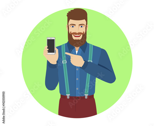 Hipster pointing at a mobile phone in his hand