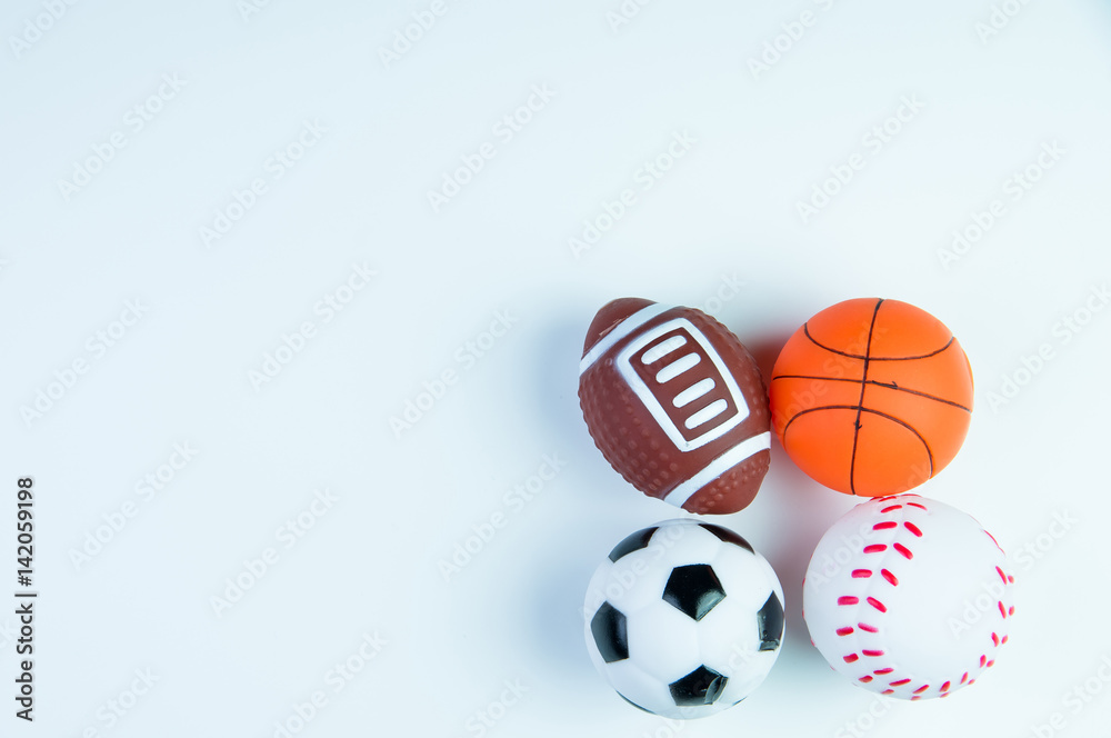 Football toy, Baseball toy, Basketball toy and Rugby toy isolated on white background with copy space.Concept winner of the sport.