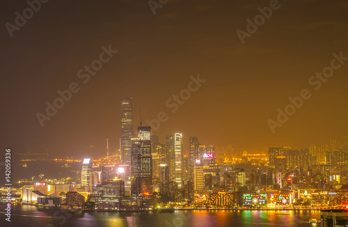 Skyscrapers and other buildings on Hong Kong Island in Hong Kong, China, viewed from the Braemar Hill on a foggy and cloudy night.