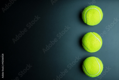 Tennis ball isolated on black background with copy space. © bubbers