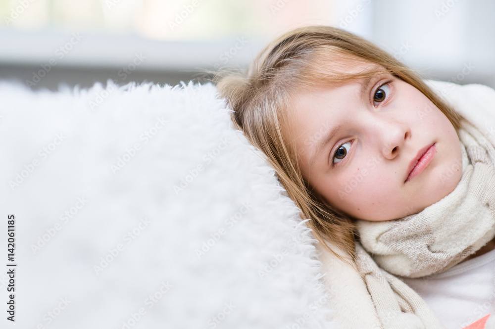 Sick girl with scarf looking at camera Sick girl with scarf looking at camera