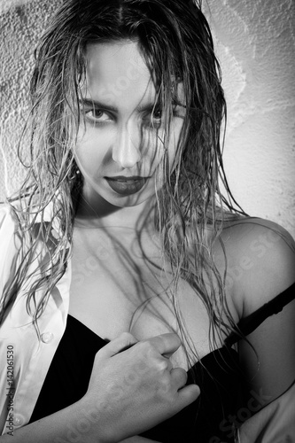 sensual beautiful blond girl with wet hair closeup portrait, monochrome