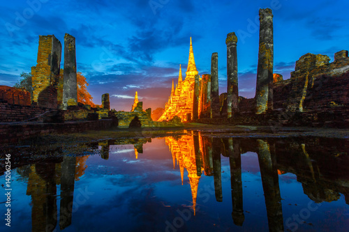 Asian religious architecture. Reflection ancient pagoda at Wat Phra Sri Sanphet temple under twilight sky after the rain. Ayutthaya Province, Thailand