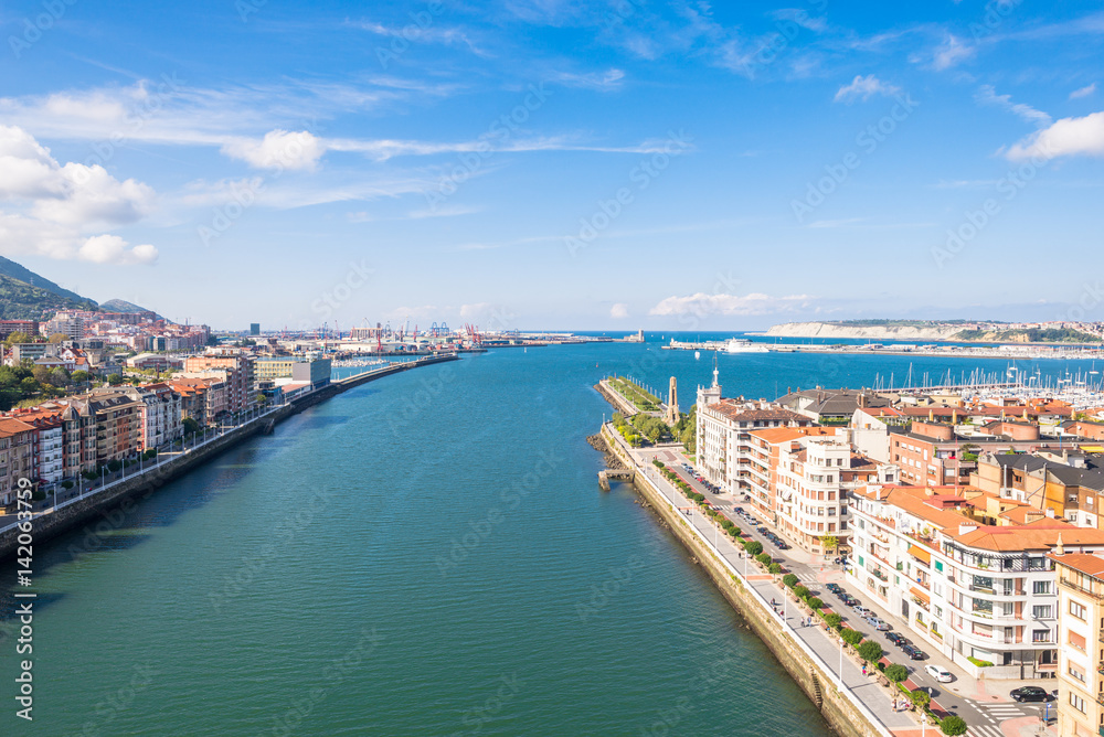 Obraz premium Up on the Vizcaya Bridge, a transporter bridge that links the towns of Portugalete and Las Arenas close to Bilbao. Look to the north with the estuary of Bilbao and the river Nervion