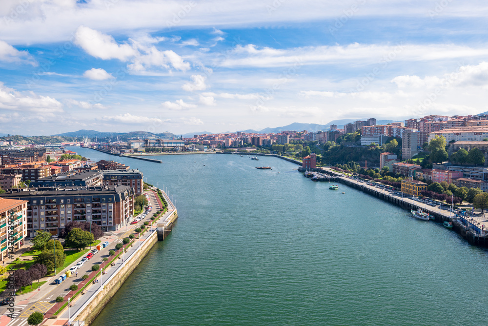 Las Arenas to the left, the Estuary of Bilbao, and Portugalete to the right, as seen from the bridge looking south. The Vizcaya Bridge is the worlds oldest transporter bridge, built in 1893