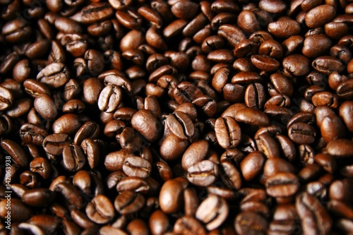 Closeup of roasted coffee beans after roasting in a drum type coffee roaster 2/2