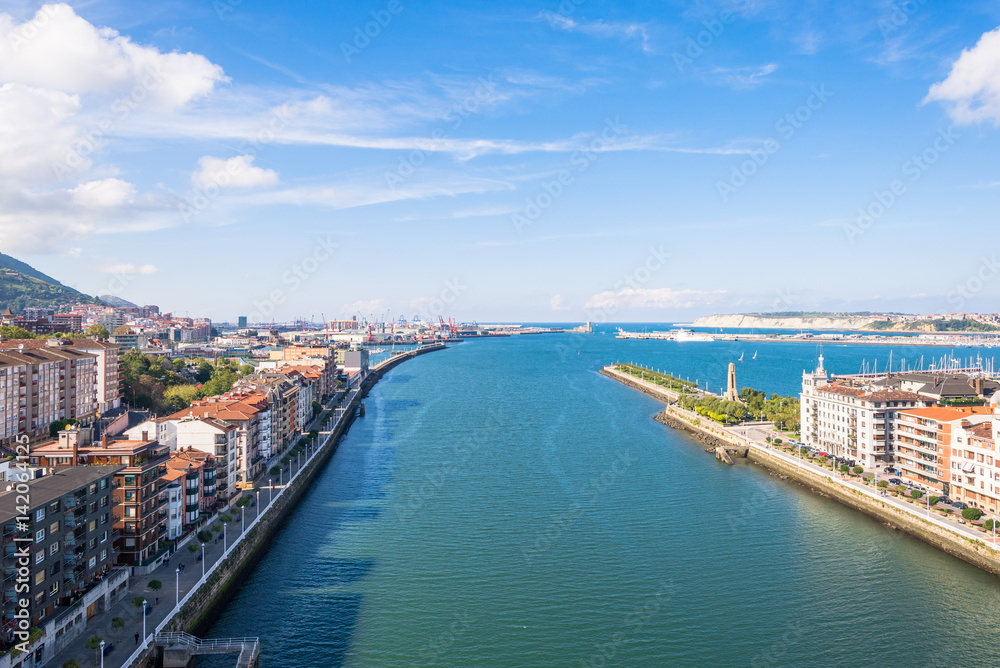 Up on the Vizcaya Bridge, a transporter bridge that links the towns of Portugalete and Las Arenas close to Bilbao. Look to the north with the estuary of Bilbao and the river Nervion