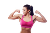 A woman in pink sports clothes shows her bicep. Isolated white background