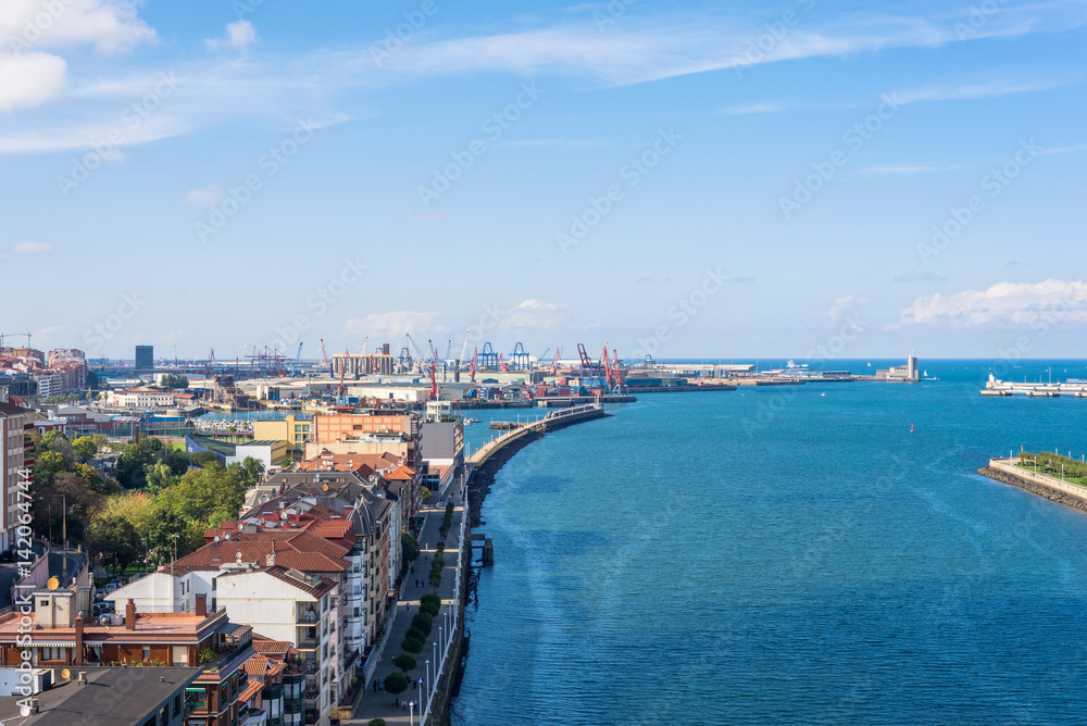 Up on the Vizcaya Bridge, a transporter bridge that links the towns of Portugalete and Las Arenas close to Bilbao. Look to the north with the estuary of Bilbao and the river Nervion