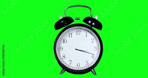 Time lapse of an alarm clock with green screen background. Professional shot in 4K resolution