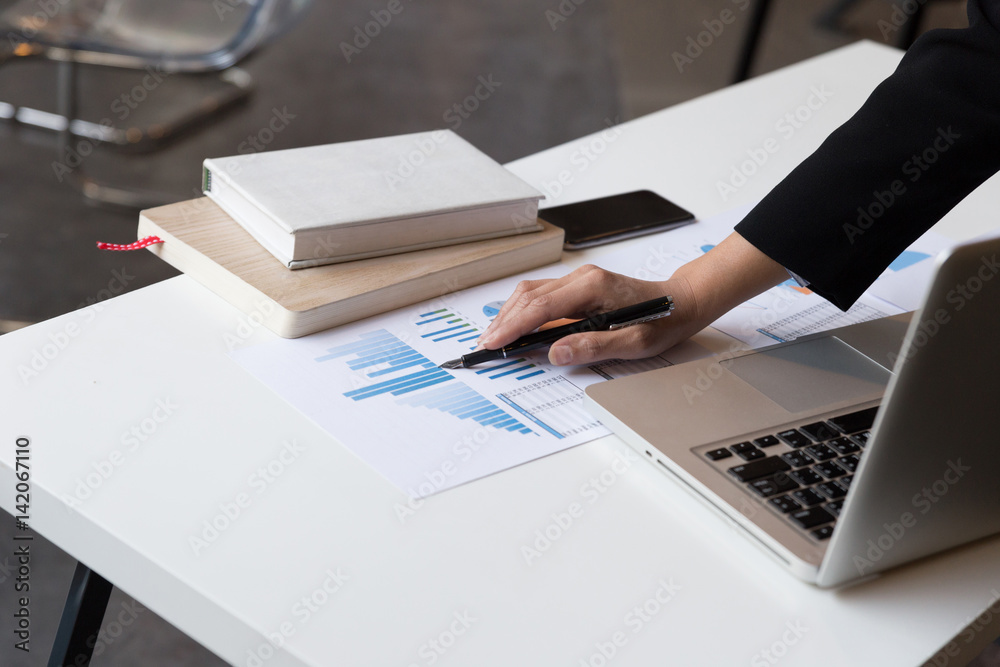 Business woman analyzing income charts and graphs with modern laptop computer. business analysis and strategy concept.