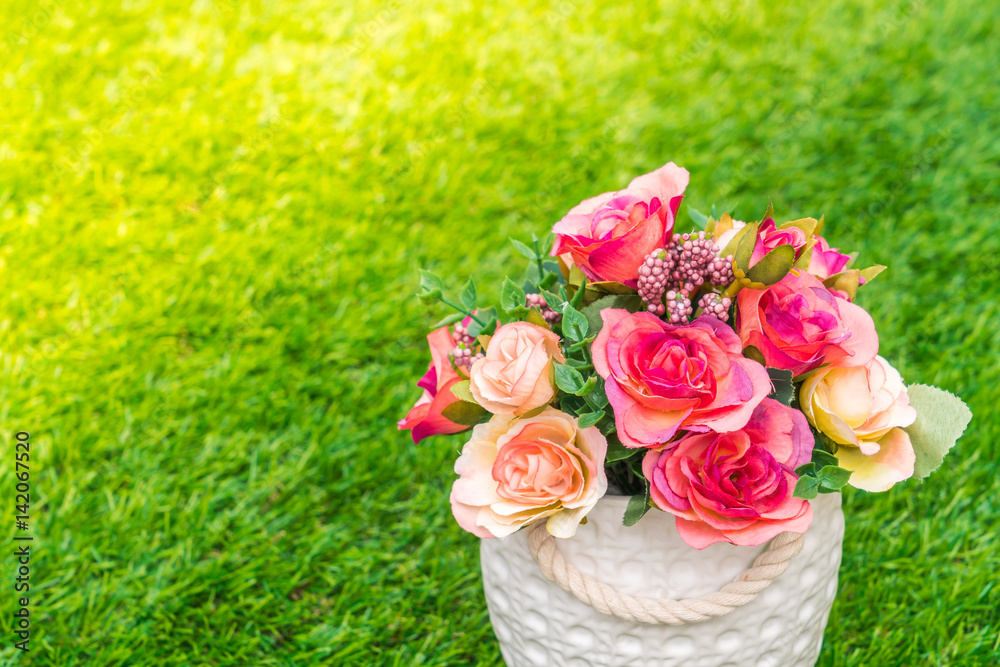 Beautiful of artificial flowers on grass