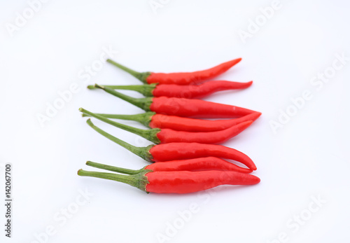 Red hot chili peppers on white background